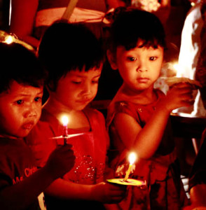 Children burning candles, By: Robertus B. Herdiyanto