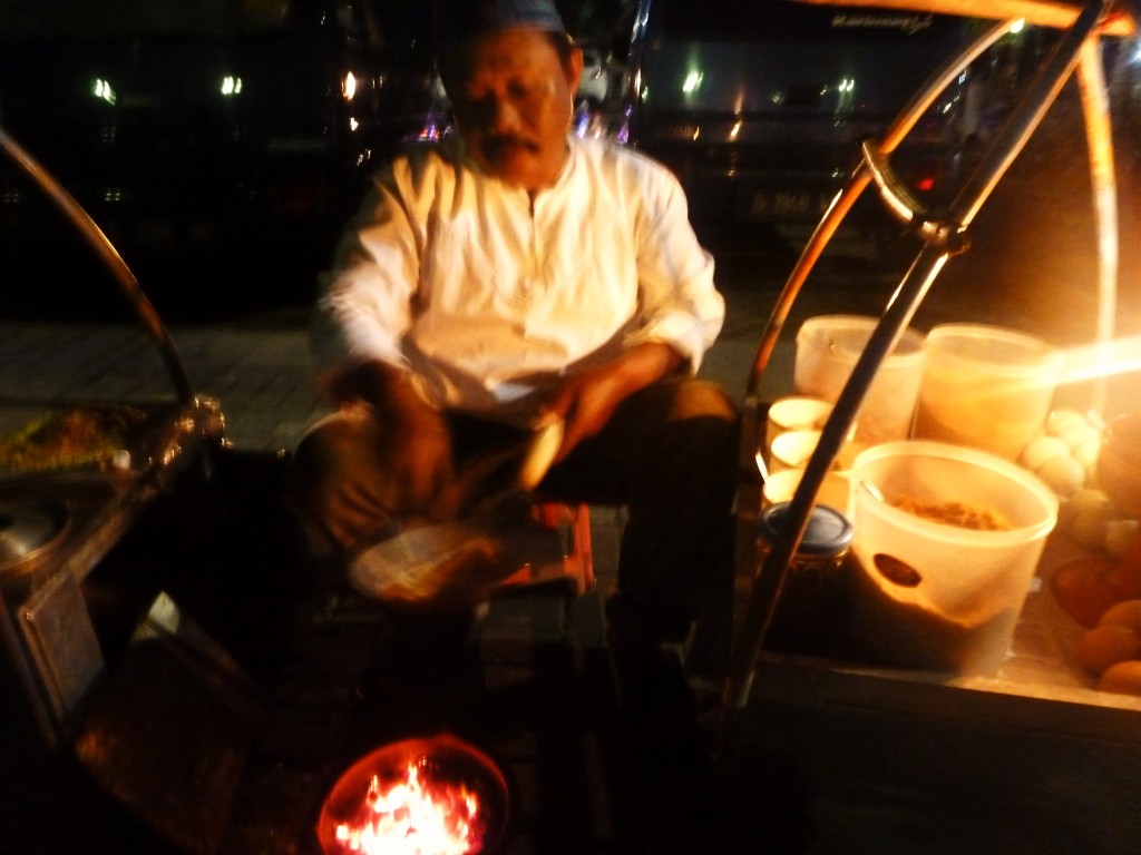 Mr. Teguh (50), who has been selling Kerak Telor at Monas in Jakarta for 30 years, By: Rani Yunus