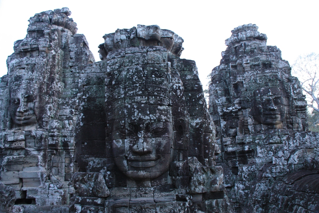 One of more than 200 heads carved on the Bayon Temple, By: Willem van Gent