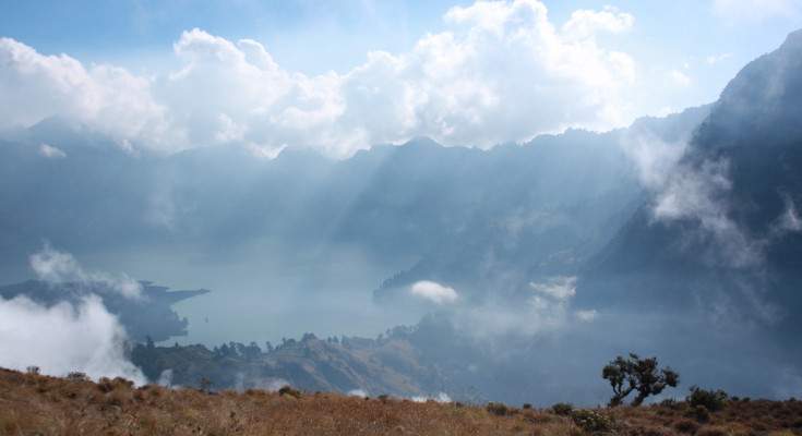 From afar, the crater of Rinjani looks beautiful and unspoiled, By: Angela Richardson