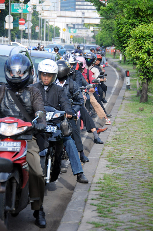 Motorcyclists at the traffic lights (Sudirman area, Jakarta) Yekaterina Gaisenok