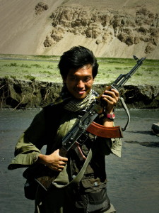 Agustinus with an ak-47 at the Wakhan Corridor, Afghanistan, By: Agustinus Wibowo