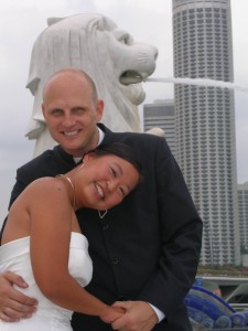 Aity and Stefan just got married, with Merlion on the background